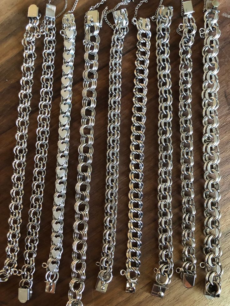 "Vintage sterling silver 'charm' chain bracelets.  These are in great condition.  Can be worn with or without charms.  Multiple sizes and widths.  I believe they are all coated with a non-tarnish coating as there is absolutely no evidence of tarnish.  All marked Sterling.  All clasps in good working order.  All with an 'on/off' safety chain.  Choices as follows: 1)  8 1/2\" L x 9mm W; 11 grams, Marked 'Forstner Sterling' 2)  8 1/2L x 8.75mm W; 12 grams, Marked 'Kremnitz Sterling' 3)  7 1/4\" L x Silver Charm Bracelet With Rolo Chain Links, Silver Chain Link Jewelry With Charms, Silver Metal Charm Bracelet With Box Chain, Silver Charm Bracelet With Rolo Chain For Gift, Silver Chain Link Bracelets With Charms, Silver Stainless Steel Chain Bracelet With Charms, Hypoallergenic Silver Chain Link Jewelry, Silver Box Chain Charm Bracelet For Everyday, Everyday Silver Charm Bracelet With Box Chain