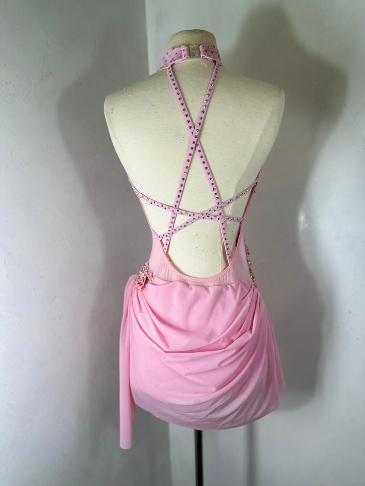 a mannequin with a pink dress on it's head and neckline