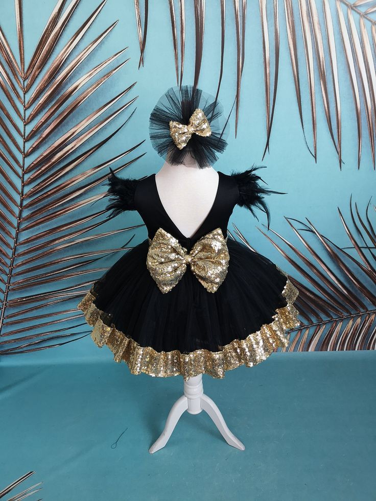 Fancy frock our Black and Gold Flower Girl Dress is completely made of health-safe and kid-friendly materials. Inner parts are 100% cotton and outer parts are sewed with high quality sequin and tulle. It also includes beautiful hairband as you see on the photos, and hairband has a click below. If you want a band please message me. In case the product photos don't show the accessory you want, just contact me and I can design and prepare it for you. I can also change the colour of this Luxury Bell Gold Flower Girl Dress, Fancy Frock, Gold Flower Girl, Gray Flower Girl, Baby Costumes Girl, Toddler Christmas Dress, Belle Costume, 1st Birthday Outfit, Fancy Frocks