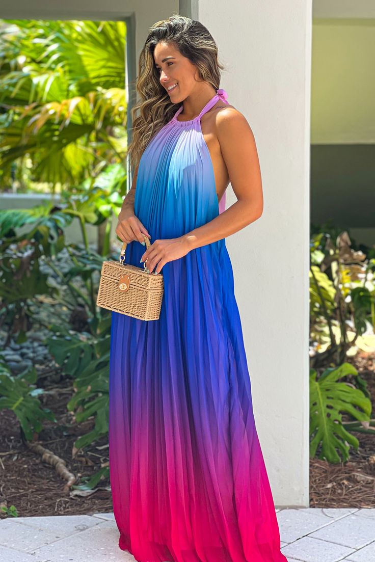 How stunning is this Pink And Purple Halter Neck Maxi Dress! A gorgeous color block maxi that features a halter neckline and flowy look! A stunning style for your next event! 100% Polyester Approx. Length (shoulder to bottom hem): -Small: 56 " -Medium: 56.5 " -Large: 57 " Approx. Bust Size: -Small: 28 " -Medium: 30 " -Large: 32 " Approx. Waist Size: -Small: 40 " -Medium: 42 " -Large: 44 " Approx. Hips Size: -Small: 54 " -Medium: 56 " -Large: 58 " Model is 5’5, 32 B bust, size 2/4 pants, size small top, and is wearing a size small. Loose Fit Halter Neck Color Block Cinched at Waist Pleats Open Back Elastic Band on Lower Back Lined Hand Wash Cold Hang or Line Dry Color: Pink, Purple, Blue *Filter Added to Main Picture. Color May Change. Spring Beach Color Block Maxi Dress, Summer Beach Color Block Maxi Dress, Summer Color Block Maxi Dress, Chic Gradient Summer Dress, Multicolor Halter Neck Maxi Dress For Beach Season, Sleeveless Ombre Maxi Dress For Party, Multicolor Maxi Halter Dress For Beach Season, Gradient Sleeveless Maxi Dress For Party, Sleeveless Gradient Maxi Dress For Party