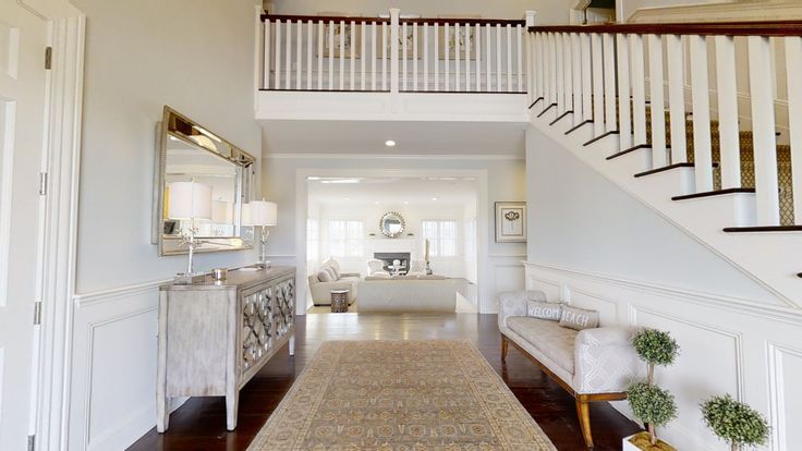 the hallway is clean and ready to be used as a living room or dining area