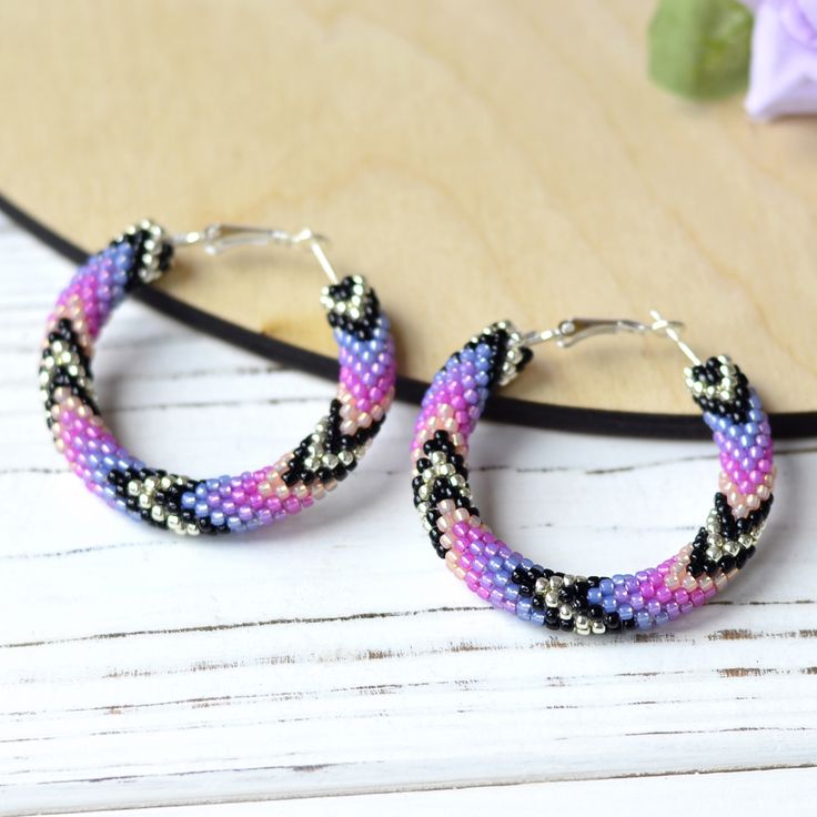 Wonderful purple hoop earrings  will be great birthday gift for women. This earrings is made of highest quality Japanese Toho beads. â¿ Diameter of hoops : 1.6 inch â¿ 100% handmade. â¿ Packed in gift bag. You will receive the same piece as pictured!!! Piece of my soul, which I left in this work, will warm you even in the most difficult and sad days. I am sure; this earrings will become your lucky charm that you would enjoy wearing day and night. Toho Beads, Purple Beaded, Birthday Gift For Women, Summer Earrings, Handmade Beaded Jewelry, Summer Earring, Beaded Hoop Earrings, Beaded Hoops, Great Birthday Gifts