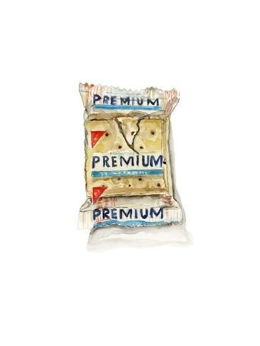 a bag of premium crackers sitting on top of a white table