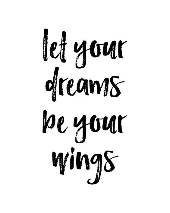 the words let your dreams be your wings in black ink on a white paper background