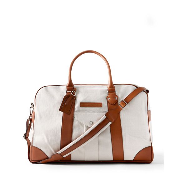 Brunello Cucinelli's generously sized weekend bag is ideal for overnight trips, whether you're travelling for business or pleasure. Crafted in Italy from hardwearing canvas, it's reinforced with sturdy leather trims and has plenty of organisational pockets, plus a convenient luggage tag and comfortable shoulder strap. Classic Travel Luggage With Top Carry Handle, Classic Satchel With Luggage Sleeve For Weekend Trips, Classic Tote Luggage For Travel, Classic Travel Tote Luggage, Classic Beige Leather Travel Bag, Classic Beige Weekender Bag With Double Handle, Luxury Coated Canvas Bags For Overnight Trips, Luxury Beige Travel Bag With Leather Handles, Luxury Weekender Bag With Leather Trim For Overnight Trips