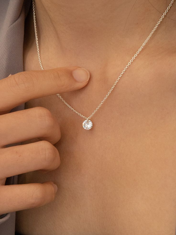 Editor's NotesIt's a necklace designed with luxurious Swarovski. It is simple, calm, and clean with a design that is easy to wear for a daily look.- To emphasize neck line- Goes well with any outfits- Aesthetic- Simple but point item- Clear and glitteringMeasurements(in.)- Size: 16.14 + 2.16 in.Composition & Care- Silver 925, SwarovskyDesigner- by Primaute Timeless Sterling Silver Necklace In Diamond White, Minimalist White Gold Solitaire Necklace With Round Pendant, Silver Jewelry Elegant, Timeless Silver Necklace With Single Diamond, Timeless Sterling Silver Solitaire Necklace For Everyday, Classic Sterling Silver Necklace With Single Diamond, Timeless Simple Silver Jewelry, Minimalist White Gold Necklace With Brilliant Cut, Fine Jewelry Everyday Sterling Silver Necklace