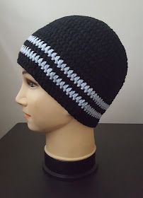 a mannequin head wearing a black hat with white and blue stripes on it