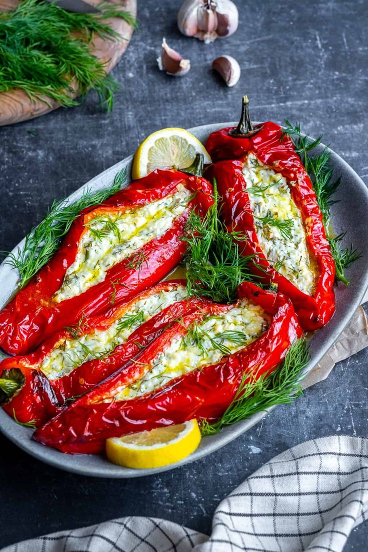 red peppers with herbs and lemon on a plate