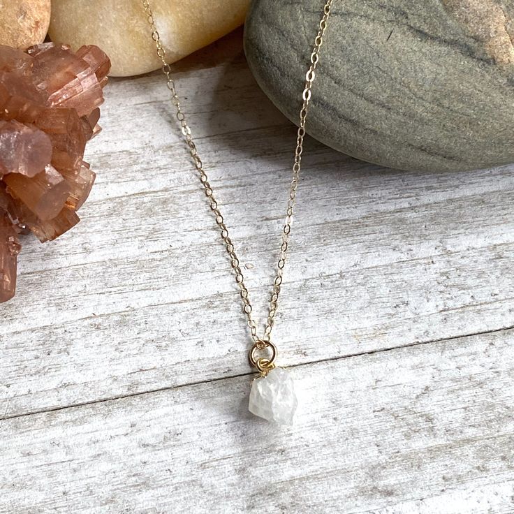 Beautiful and all-natural moonstone gemstones electoplated in 14k gold and hung from a dainty an light-catching gold fill chain. ✧ Hand-picked stones electroplated in 14k gold. ✧All natural stones ✧ High quality gold fill chain and clasp ✧ Lightweight and easy for everyday ✧ Ready for gifting in a hand-stamped boho gift box. ✧Super fast shipping. Usually same day or next day. About our gems* Each of the stones we use to create pieces were formed by nature over millions of years. Each one is uniq Gold Spiritual Crystal Necklace For Everyday, Everyday Gold Spiritual Crystal Necklace, White Crystal Necklace With Delicate Chain As Gift, Everyday Spiritual Gold Crystal Necklace, White Crystal Necklace With Delicate Chain For Gifts, Gold Minimalist Charm Necklaces With Natural Stones, Minimalist Gold Charm Necklace With Natural Stones, Minimalist Gold Charm Necklaces With Natural Stones, Dainty Crystal Necklace With Adjustable Chain For Healing