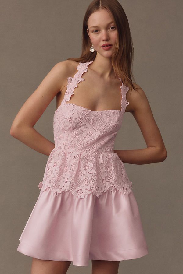 The BHLDN Mari Sleeveless Tiered Lace Mini Dress epitomizes romantic charm with its intricate lace detailing and flattering tiered silhouette, perfect for making a statement at any special occasion | Mari Sleeveless Tiered Lace Mini Dress by BHLDN in Pink, Women's, Size: Medium, Polyester/Nylon/Rayon at Anthropologie Sleeveless Lace Dress With Ruffles For Party, Spring Tiered Lace Dress With Ruffles, Feminine Tiered Lace Dress, Tiered Lace Patchwork Dress For Garden Party, Elegant Tiered Mini Dress With Fitted Bodice, Sleeveless Lace Bridesmaid Dress For Summer, Sleeveless Lace Dress For Summer Bridesmaid, Summer Sleeveless Lace Bridesmaid Dress, Feminine Sleeveless Lace Dress With Fitted Bodice