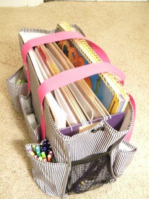 a bag filled with lots of books sitting on the floor