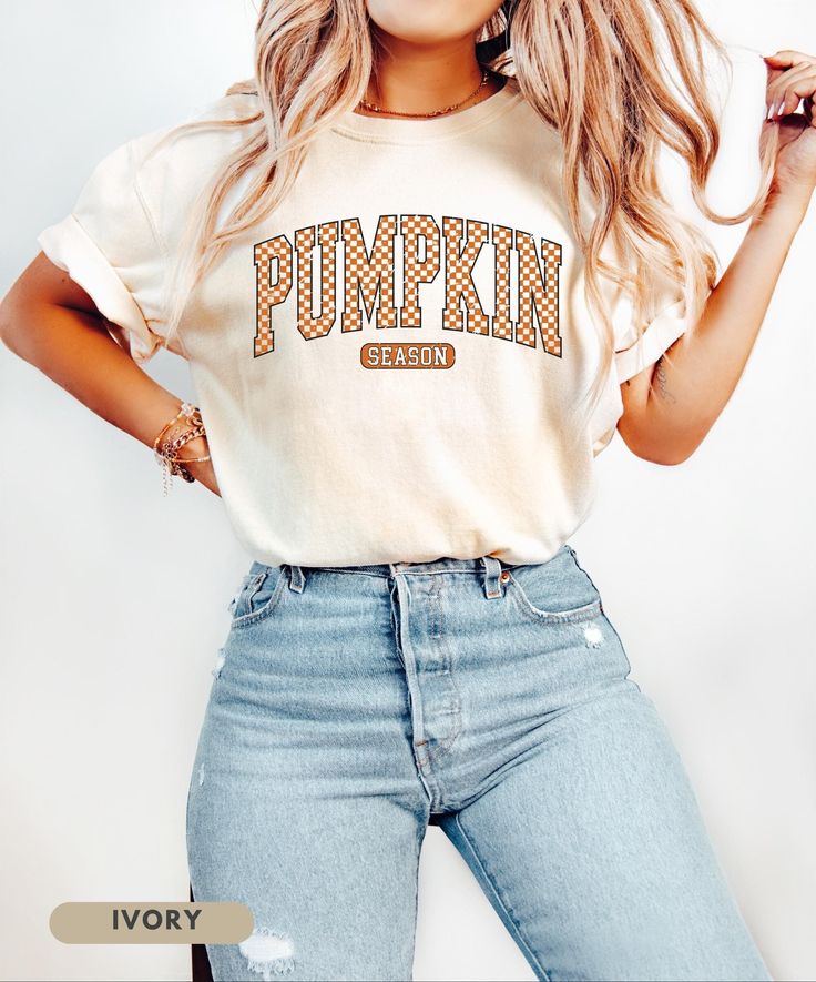 ⬇️ 》PLEASE READ TERMS BEFORE PURCHASE《 ⬇️ Embrace the cozy vibes of autumn with our Pumpkin Season T-Shirt! This eye-catching shirt features bold, retro-inspired checkered lettering that screams fall fun. Perfect for pumpkin patch visits, hayrides, or sipping your favorite pumpkin spice latte. Soft, warm, and brimming with autumn spirit - it's the ideal blend of comfort and style for those crisp fall days. A must-have for anyone who lives for pumpkin season and wants to show it off in vintage-in Fall Letter Print T-shirt For Loungewear, College Fall T-shirt With School Spirit, Cute College Tops For Fall, Cotton T-shirt For Fall Loungewear, Cozy Short Sleeve Tops For Fall, Soft-washed T-shirt For Fall Loungewear, Fall School Spirit Graphic T-shirt, College Letter Print T-shirt For Fall, Cozy Relaxed Fit T-shirt For Fall