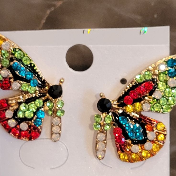 Bright Crystals In Red, Blue, Green, Clear, Black And Dark Yellow Adorn These Cheerful And Unique Earrings. Nwt Multicolor Butterfly Earrings For Pierced Ears, Multicolor Butterfly Earrings For Party, Butterfly Stud Earrings, Crystal Butterfly, Butterfly Earrings Stud, Dark Yellow, Red Blue Green, Source Unknown, Unique Earrings