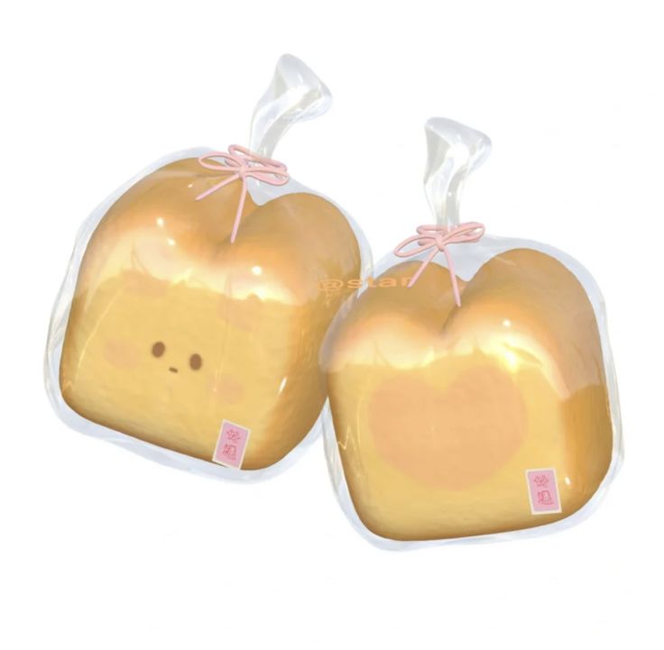 two shiny gold heart shaped candies wrapped in plastic