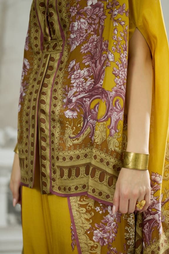 Mustard cape with floral stripe print and attached belt in front. Paired with printed dhoti pant and belt. - Aza Fashions Rajdeep Ranawat, Cape For Women, Silk Cape, Cape Pattern, Dhoti Pants, Tarun Tahiliani, Yellow Silk, Satin Color, Floral Stripe