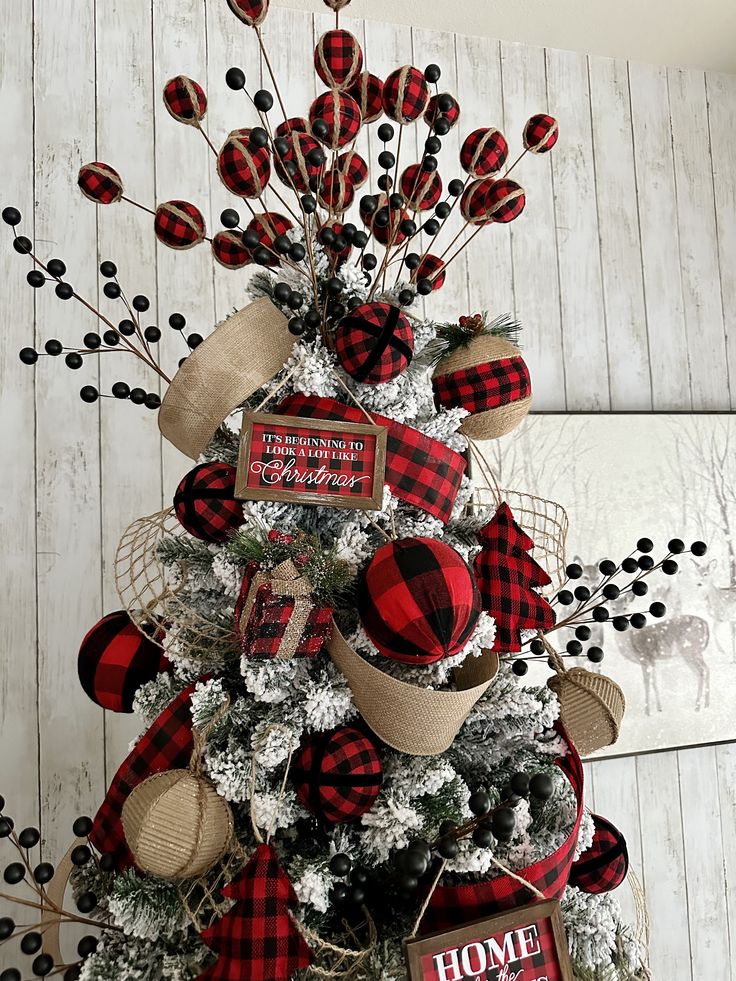 a christmas tree decorated with red and black plaid