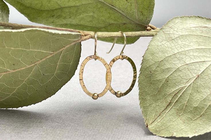 These gold filled circle earrings are so dainty and unique! They look great for women and men, minimalist and lightweight.  The 18 K gold filled circle charms are about 0.75" ( 19 mm ) long and the earrings full length is about 1.1" ( 27 mm ).  Very elegant, lightweight and so comfortable for everyday use. Sold as a pair. ~ All items are beautifully packed ready to give as a gift and carefully wrapped up to ensure a safe delivery. ~ The environment is very important for us therefore, in order to Minimalist Oval Everyday Earrings, Minimalist Nickel-free Oval Earrings, Nickel Free Oval Minimalist Earrings, Nickel-free Oval Minimalist Earrings, Dainty Oval Earrings For Everyday, Minimalist Handmade Oval Earrings, Handmade Minimalist Oval Earrings, Handmade Oval Minimalist Earrings, Drop Earrings Simple