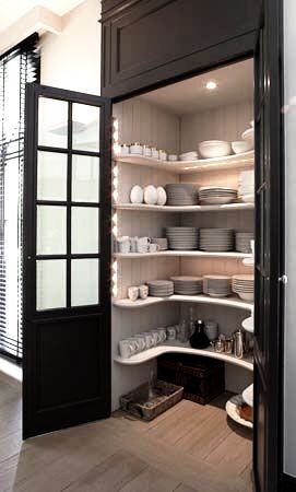 an open pantry filled with lots of dishes