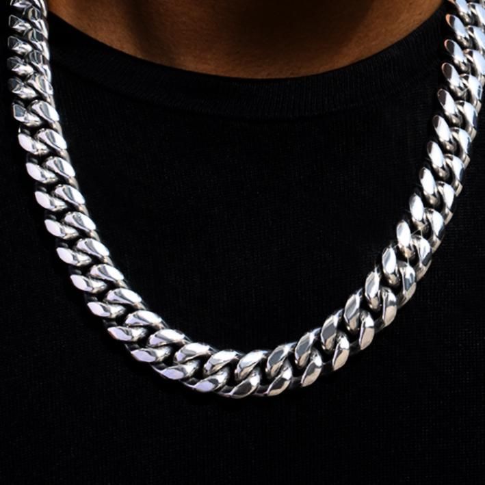 Elevate your style with this 14mm stainless steel Cuban link chain. At 18 inches long, it's perfect for everyday wear, boasting a secure box clasp for added durability. Made from premium 316L stainless steel, this chain is waterproof, sweatproof, and tarnish-resistant. Ideal for gifting or personal use, its timeless design pairs effortlessly with any outfit. Add this must-have accessory to your collection today! ⛓️🔥 Luxury Cuban Link Stainless Steel Chain Necklace, Cuban Link Necklace With Solid Link Construction, Cuban Link Necklace With Solid Link Construction As Gift, Gift Cuban Link Necklace With Solid Construction, Stainless Steel Curb Chain Jewelry, Silver Cuban Link Necklace With Curb Chain As Gift, Everyday Silver Cuban Link Necklace In Stainless Steel, Silver Stainless Steel Cuban Link Necklace For Everyday, Gift Chunky Chain Stainless Steel Jewelry