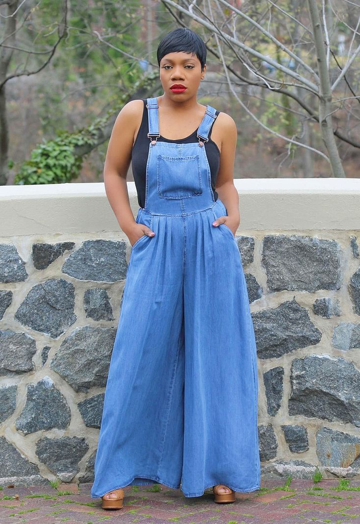 Wide Leg Overalls Get ready for warmer days in our fabulous denim wide leg overalls. Featuring a lightweight woven denim blend fabric shapes this jumpsuit. Buckled straps, front pocket, a fitted bodice, and a high and wide legs that have side seam pockets. Model is 5'5 wearing size M (8-10) Runs true to size. Sleeveless. Front pocket. Buckle closure. Side zipper. Side pockets. Wide Leg. Inseam approx. 32". 100% Tencel. Light Wash Overall Jumpsuits And Rompers With Pockets, Light Wash Overall Jumpsuit With Pockets, Full-length Denim Blue Jumpsuit For Spring, Chic Medium Wash Jumpsuits And Rompers With Pockets, Chic Dark Wash Jumpsuits And Rompers With Pockets, Spring Full Length Denim Jumpsuit, Chic Medium Wash Denim Jumpsuit With Pockets, Chic Denim Jumpsuit With Pockets, Dark Wash Full-length Denim Jumpsuit