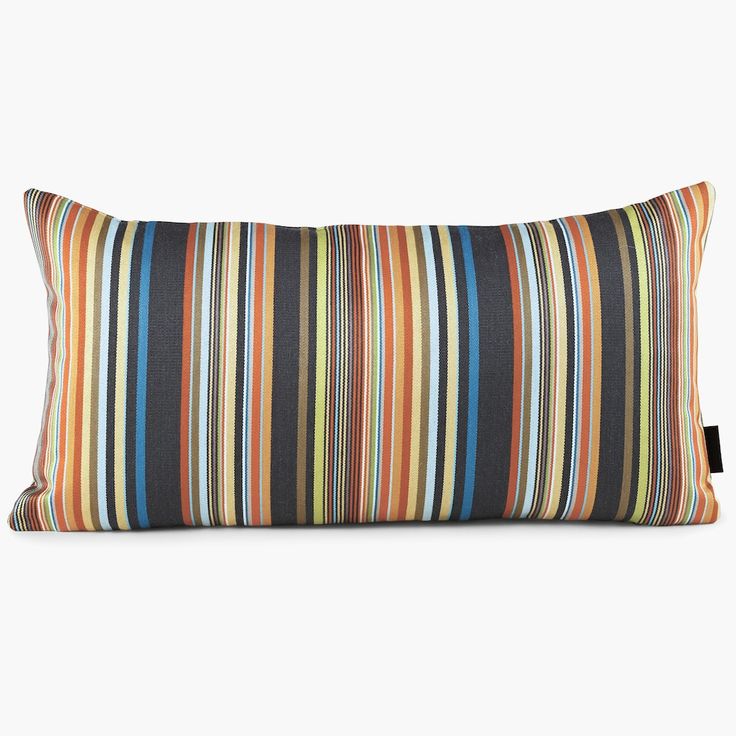 a multicolored striped pillow with a black tag on the front and back side