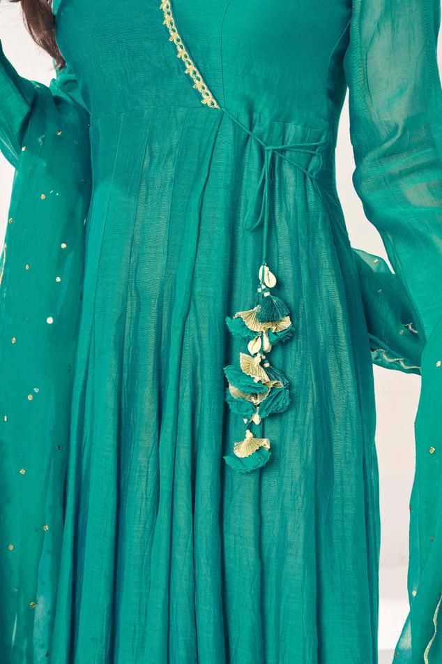 Parrot green soft chanderi angrakha anarkali with aari, pita and mukaish embroidered neckline. Comes with pant and a dupatta.
Components: 3
Pattern: Embroidered
Type Of Work: Aari, Pita, Mukaish
Neckline: V Neck
Sleeve Type: Full
Fabric: Anarkali: Soft chanderi, Pant: Cotton stretch, Lining: Chanderi
Color: Green
Other Details: 
Attached lining
Length:
Anarkali: 52 inches
Sleeves: 23 inches
Pant: 38 inches
Dupatta: 2.5 mtrs
Occasion: Mehendi and Haldi - Aza Fashions Angrakha Anarkali, Green Anarkali, Parrot Green, Types Of Work, Green Soft, Embroidered Neckline, Set For Women, Pita, Anarkali