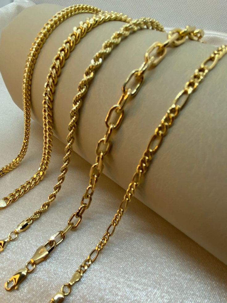 "18k Gold Rope bracelet, 7.5 inches ,3.44 gr ,3.30mm 18k Gold Figaro bracelet, 8\" inches ,1.5mm 14k Gold Franco bracelet, 7.5 inches ,4.22 gr ,3.20mm 14k Gold Curb Chain bracelet, 7.5 inches ,6.70 gr , 5mm 14k Gold Cable Chain bracelet, 7.5  inches ,4.65 gr , 5mm Please let me know if you want to customize the size . Premium lobster clasp Hook for added safety! Priced to sell! Compare our prices to other similar sellers! Arrives in a GIFT BOX and includes FREE SHIPPING within the USA and Canada. International shipping is available at the most economical rates on ETSY. I HAVE BEEN IN THE JEWELRY BUSINESS ALL MY LIFE. I am a second -generation family member making gold and jewelry. Please feel free to ask me any questions - Always happy to help! Fast Replies to messages! Superior Quality an Franco Bracelet, Gold Rope Bracelet, Fast Replies, Real Gold Bracelet, Figaro Bracelet, Gold Curb Chain, Bracelet For Her, Curb Chain Bracelet, Wrist Jewelry