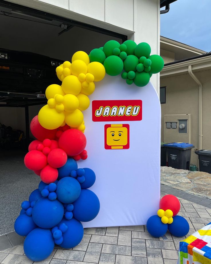 an inflatable balloon arch with the name janneu on it and balloons surrounding it