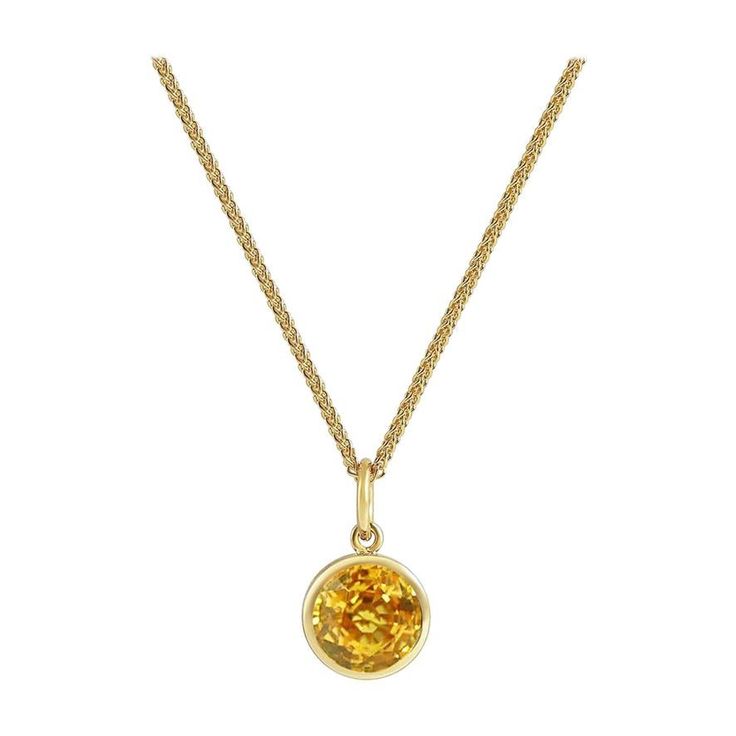 Handcrafted 1.50 Carats Yellow Sapphire 18 Karat Yellow Gold Pendant Necklace. The 7mm natural stone is set in our iconic hand pierced gold lace to let the light through. Our pendants are the ideal gift. Here presented on our finely knitted gold chains. Chain is included in the price, its length is 17 inches adjustable at 16 inches. Pendant measures 8mm diameter. Choose from our selection of precious stones and fine gems to fit ones birthstone or favorite color. Our lace on the reverse allows na Yellow Gold Birthstone Necklace With Round Stone, Round Gold Gemstones Fine Jewelry, Yellow Gold Citrine Round Pendant Necklace, Yellow Gold Birthstone Gemstones, Round Shape, Yellow Gold Birthstone Gemstone, Hallmarked Amber Round Necklace, Yellow Gold Birthstone Gemstone Pendant, Yellow Gold Citrine Round Pendant Jewelry, Yellow Gold Birthstone Necklace With Prong Setting