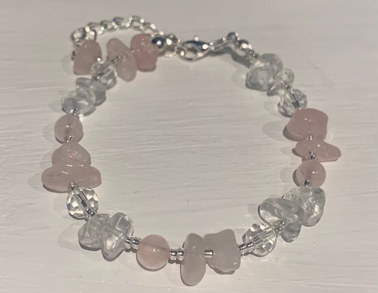 Beautiful Rose Quartz and clear quartz crystal beaded bracelet- containing rose quartz chips and beads, clear quartz chips, clear crystal beads and silver miyuki glass seed beads Fastenings are silver plated As there are small parts please keep away from small children as they may be a choking hazard To avoid damage please remove before showering, swimming or sleeping  Many thanks for visiting my Etsy store - please do take a look at my other items I hope you have a lovely day:) *all orders come with one jewellery pouch, if you require any additional they are available in my store for £1.00 Beaded Rose Quartz Crystal Bracelet, Silver Rose Quartz Beaded Bracelets For Healing, Handmade Rose Quartz Crystal Bracelet With Round Beads, Rose Quartz Beaded Jewelry With Stones, Handmade Rose Quartz Beads Crystal Bracelet, Spiritual Beaded Rose Quartz Crystal Bracelet, Rose Quartz Jewelry With Round Beads And Stones, Spiritual Rose Quartz Beaded Crystal Bracelet, Rose Quartz Jewelry With Round Beads