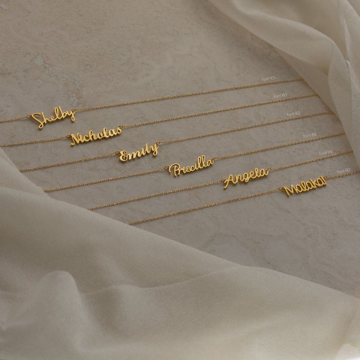 She’s style and grace — this whimsical font allows you to express yourself while keeping it elegant. The Grace Name Necklace sits on a delicate chain adding some extra oomph to your everyday outfit. Make it unique and customize the nameplate, perfect for yourself or for gifting on a special occasion. Material: High-Quality Solid 925 Sterling Silver Dimensions: Depending on your font choice, height sizes range from 3mm to 4mm lowercase Finish: Sterling Silver ∙ 18K Gold ∙ Rose Gold SKU: HH-NH02F6 Dainty Customizable Name Necklace For Everyday, Dainty Customizable Name Necklace, Customized Minimalist Name Necklace, Dainty Customized Name Necklace For Everyday, Dainty Customized Name Necklace For Everyday Wear, Minimalist Adjustable Name Necklace, Customizable Everyday Nameplate Necklace, Everyday Customizable Nameplate Necklace, Minimalist Name Charm Necklace For Personalized Gift