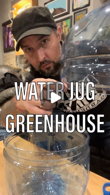 a man pouring water into a glass container with blue liquid in it and the words water jug greenhouse above him