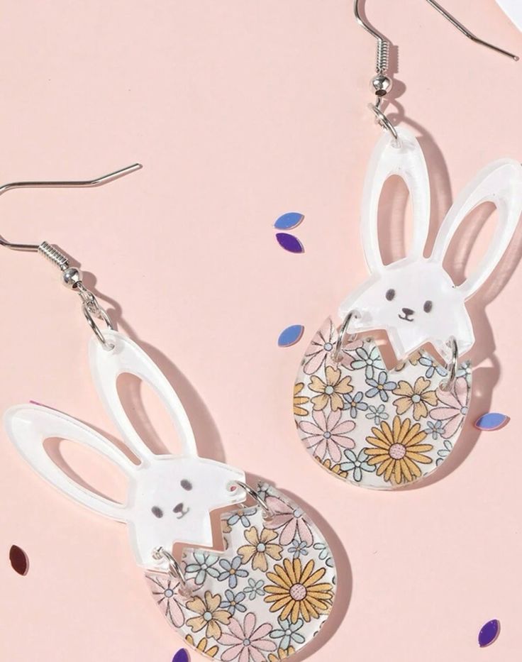 Adorn yourself with charm and whimsy wearing our Beautiful Bunny Earrings. Delicately crafted, these earrings add a playful touch to your style, perfect for expressing your unique personality. Playful White Dangle Jewelry, Novelty White Dangle Earrings, Novelty White Earrings For Pierced Ears, Whimsical White Round Jewelry, Whimsical Drop Earrings, Whimsical Flower Drop Earrings For Gifts, Whimsical Flower Drop Earrings As Gift, White Fun Dangle Earrings, Whimsical White Flower Earrings