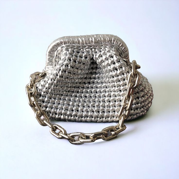 ELEGANT HIGH QUALITY CLUTCH ✔️Crochet Metallic Raffia Mini Clutch Bag is knitted with metallic yarn ✔️The interior of the raffia bag is fully lined with satin and has a hidden metal lock.  ✔️This bag has acrylic chain strap. You can remove the long chain strap if you want. Suitable for use as handbag, make-up bag, evening bag, or party bag ✔️You can use it day and night, with you stylish or casual outfits. ✔️Handcrrafted in Turkey ✔️Hand-crocheted with care ✔️A lining of the appropriate color is Elegant Knitted Shoulder Bag For Everyday Use, Elegant Knitted Rectangular Shoulder Bag, Evening Crochet Pouch Bag With Braided Handles, Evening Crochet Clutch Shoulder Bag, Elegant Crochet Pouch Bag With Braided Handles, Elegant Handheld Crochet Shoulder Bag, Elegant Crochet Handheld Shoulder Bag, Evening Crochet Pouch Bag, Elegant Crochet Handheld Bag