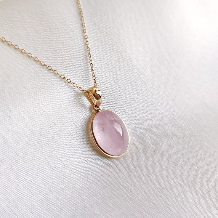 This stunning pendant is set in 14k Solid Yellow Gold with Natural Morganite with utmost precision. It is an unique gemstone pendant for nearly every occasion and is completely hassle-free jewelry. ITEM DETAILS: * Gem: Morganite * Gem Size: 10X13mm * Gem Shape: Oval * Gem Eeight: 6.46 carats * Gold Purity: 14KT * Gold Weight: 0.56 gram * Total Weight of the Pendant: 1.85 gram The Gold purity is guaranteed and it comes with authentic 14KT gold hallmark. Since my items are handmade, they are absolutely nickel and lead free. CUSTOMIZATION: * Gemstone customization is available and it can be substituted with a gem of your choice. Kindly message me for the same. PACKAGING * The Pendant comes with layers of safe and secure wrapping along with Free handmade jewelry box with every purchase. ➡️Head Yellow Gold Oval Pendant Birthstone Necklace, Yellow Gold Birthstone Necklace With Oval Pendant, Oval Yellow Gold Birthstone Necklace With Gemstone, Oval 14k Gold Gemstones For Gift, Oval 14k Gold Gemstones As Gift, Yellow Gold Pendant Jewelry With Large Stone, Rose Quartz Gemstone Pendant Jewelry, Fine Jewelry Oval Pendant Birthstone Necklace, Fine Jewelry Birthstone Necklace With Oval Pendant