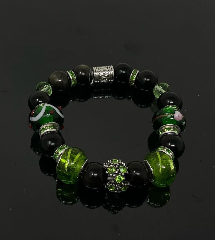 Black and green bracelet Green Jewelry With Black Beads As A Gift, Green Jewelry With Black Beads For Gift, Green Beaded Bracelets With Black Beads As A Gift, Casual Green Jewelry With Black Beads, Green Bracelets With Black Beads As Gift, Elegant Green Stretch Bracelet Gift, Elegant Green Stretch Bracelet For Party, Casual Green Bracelets For Gifts, Casual Green Bracelet