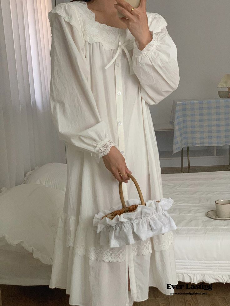 Indulge in timeless elegance with our Cottage Ruffle Lace Nightgown Dress. Crafted with delicate lace and adorned with charming ruffles, this nightgown exudes a romantic and feminine allure. The flowing silhouette offers comfort and freedom of movement, perfect for lounging in style or enjoying a peaceful night's sleep. Elevate your bedtime routine with this enchanting nightgown that combines classic beauty with modern comfort. Features: 100% Cotton Relax Fit Breathable (great for all seasons) M Cottagecore Lace Trim Nightgown For Loungewear, Cottagecore Nightgown With Lace Trim For Loungewear, Cottagecore Nightgown With Lace Trim For Bedtime, Cottagecore White Nightgown With Lace Trim, Cottagecore Lace Trim Sleep Dress, Cottagecore Ruffled Nightgown For Daywear, White Cottagecore Sleepwear With Lace Trim, Cottagecore White Sleepwear With Lace Trim, Cottagecore Sleepwear With Lace Trim