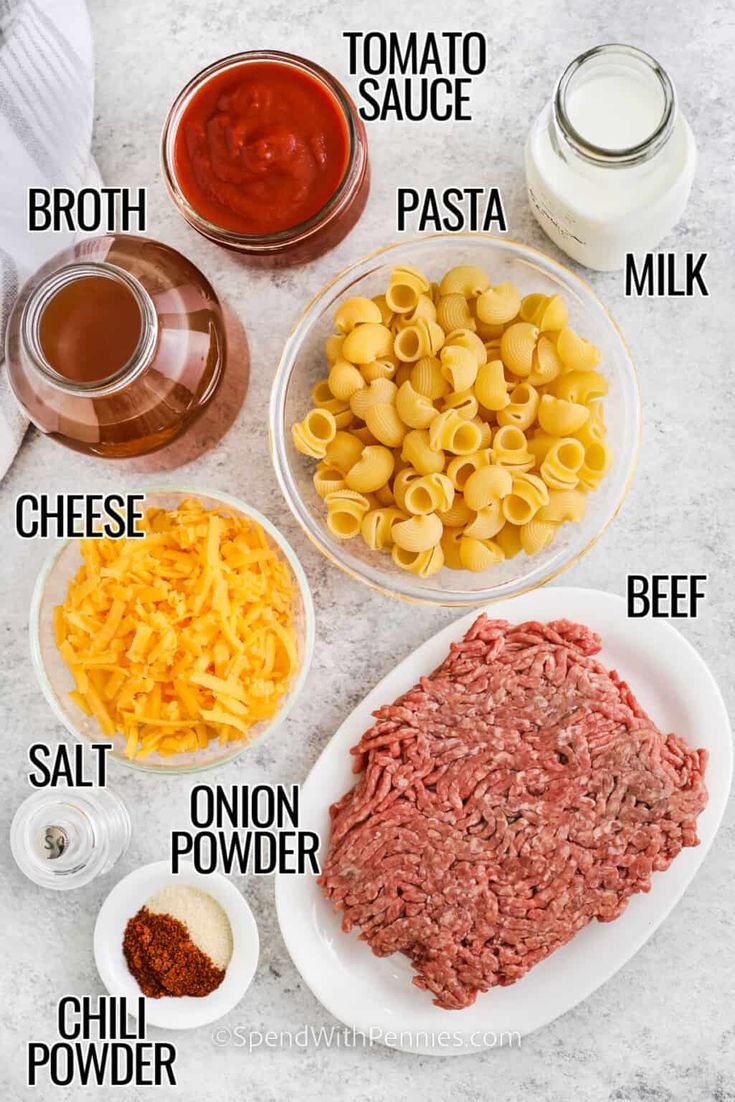 the ingredients to make an italian pasta dish are shown on a marble countertop, including meat, cheese, tomato sauce, broccoli, and macaroni