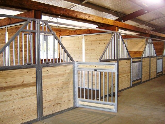 the inside of a building with wooden walls and metal railings on each side of it