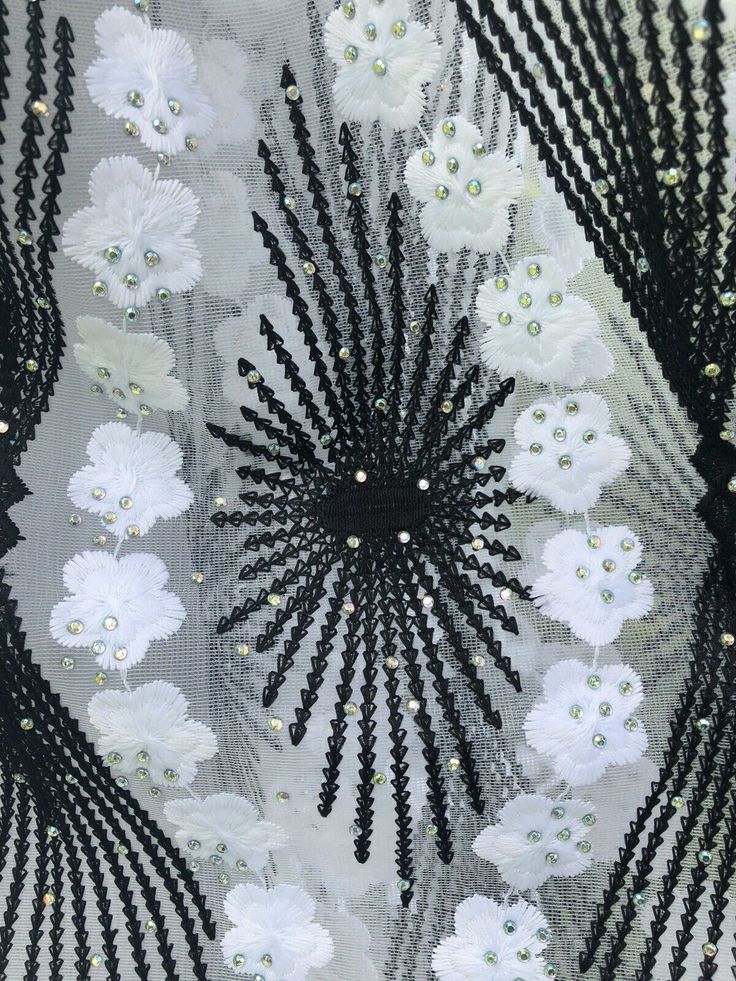 Absolutely Beautiful Embroidery lace with beads and sparkly rhinestone . Color White with black ornaments . Eco- Friendly. Breathable. Width 51”-52”sold by 1 yard. Elegant White Embroidered Fabric For Summer, White Fitted Sequin Fabric For Summer, Glamorous White Sequin Fabric For Wedding, White Embroidered Fabric For Party, White Fitted Embroidered Fabric For Party, White Lace For Spring Party, Elegant White Embellished Lace, Embroidered White Tulle Fabric For Party, Elegant White Embroidered Fabric And Notions