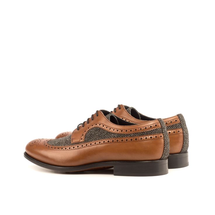 Order as shown or design this shoe yourself: Click CUSTOMIZE Similar to a Full Brogue, the Long Wingtip Blucher is unique in that one brogue panel extends from the toecap all the way to the heel of the shoe. Like a Full Brogue, the Long Wingtip Blucher is a classic style suitable for formal occasions and office wear alike. Handmade in Spain in 27 days. Materials: herringbone sartorial + med brown painted calf Lining: navy calf leather Sole: leather sole + buttons rubber injections Last: Rounded Brown Wingtip Lace-up Shoes With Leather Lining, Brown Wingtip Dress Shoes With Leather Sole, Brown Leather Lined Wingtip Lace-up Shoes, Brown Goodyear Welted Leather Wingtip Shoes, Brown Leather Wingtip Shoes With Goodyear Welt, Cognac Leather Shoes With Brogue Detailing For Semi-formal Occasions, Masculine Brown Wingtip Leather Shoes, Brown Goodyear Welted Wingtip Dress Shoes, Masculine Brown Leather Wingtip Shoes