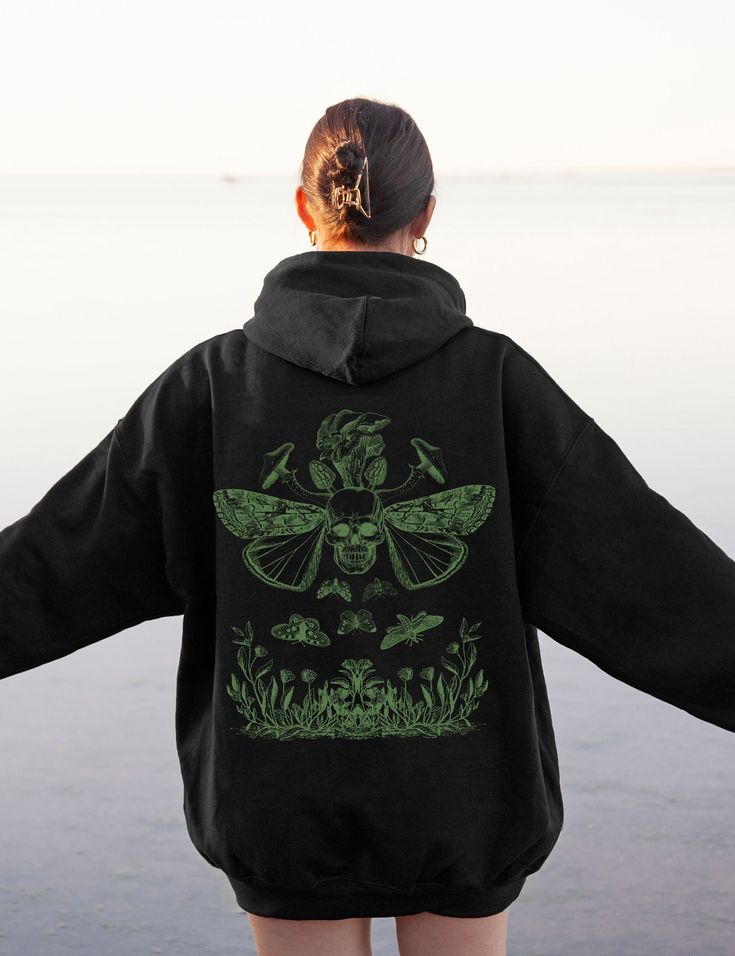 Fairy grunge art with butterfly skull and mushrooms on a pullover unisex hoodie in Black that's soft, cozy and warm for the colder months. Plus sizes available for a roomy fit. Size up for an oversized look. Size chart found in images. Perfect lounge staple for yourself or as a gift for your favorite fairy lover! * 50% cotton, 50% polyester * Double-lined hood * Double-needle stitching throughout * Air-jet spun yarn with a soft feel and reduced pilling * 1x1 athletic rib knit cuffs and waistband Fairy Grunge Art, Skull And Mushrooms, Butterfly Mushroom, Dark Cottagecore Aesthetic, Mushroom Hoodie, Fairy Grunge Aesthetic, Butterfly Skull, Skull Butterfly, Oversized Aesthetic