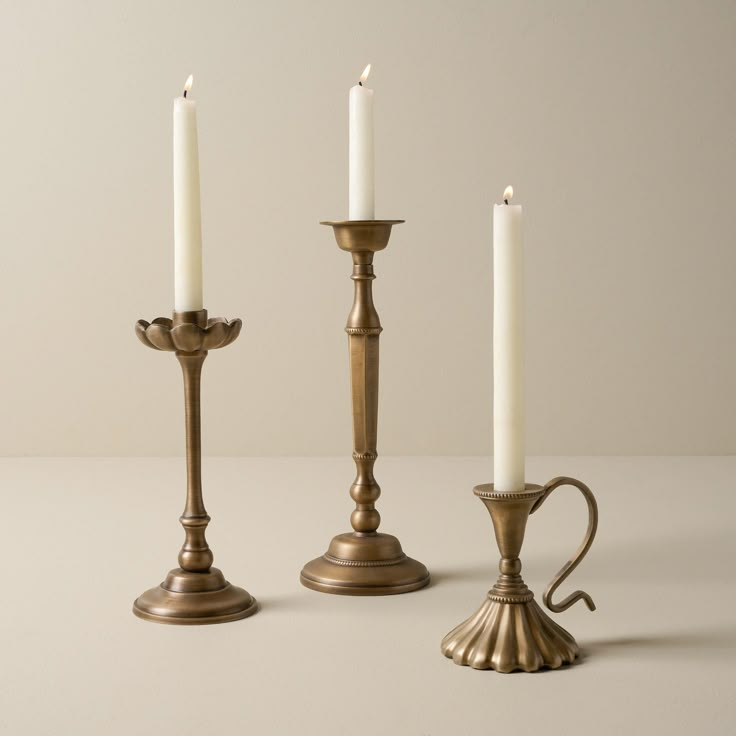 three candles are sitting next to each other