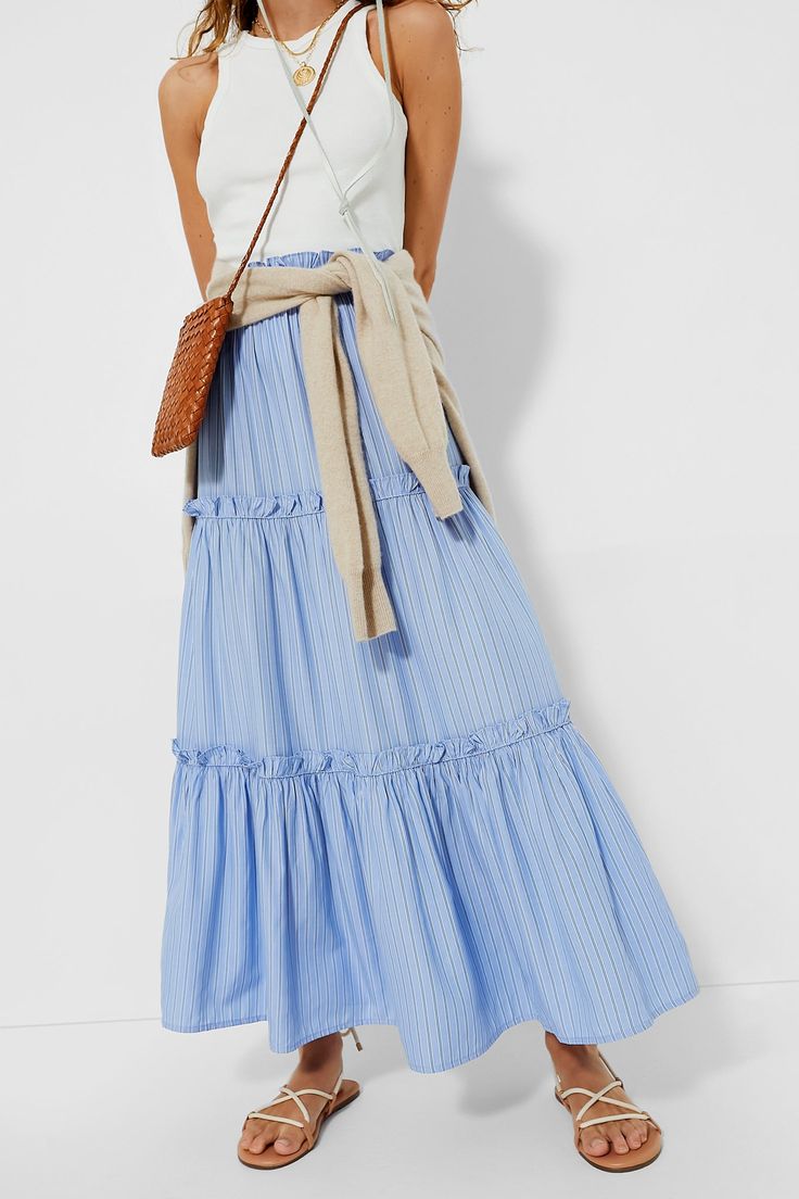 Twirl worthy with its tiered layers and ruffle detailing, the Cornflower Blue Stripe Prado Skirt slips on with minimal effort while bringing maximum style. This pull on maxi is a one step elevation to a casual look while keeping you ultra-chic. Pair with a fitted tank or blouse and sandals, sneakers, or flats! Elastic ruffle waistband Tiered skirt Ruffle seams Pleated style Contrast ruffle hem Unlined and slightly sheer Material: 60% Polyester, 40% Rayon Care: Hand wash cold, hang to dry Skirt Ruffle, Plus And Minus, Cocktail Attire, Sheer Material, Weekend Wear, Cornflower Blue, Tier Skirt, Night Looks, White Summer