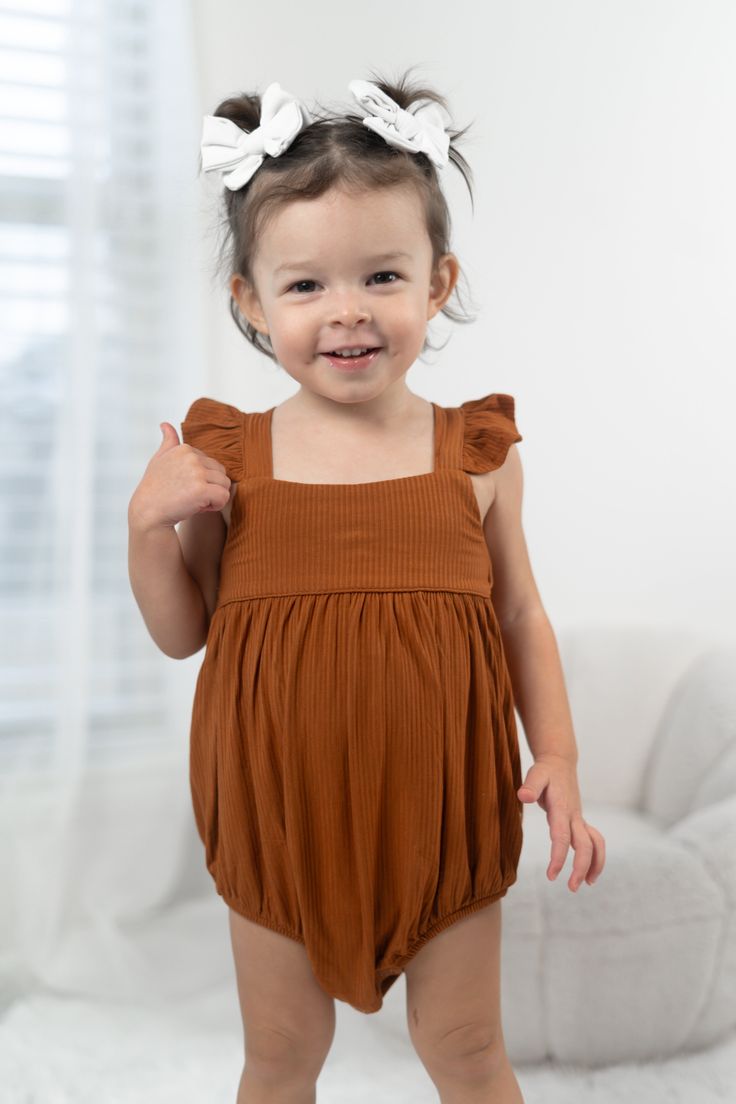 Get ready to have the sweetest dreams in our Copper Rib Dream Bubble Romper. Made from soft copper rib material, this sleeveless romper is perfect for spring and summer weather. The dreamy bubble design adds a playful touch, while the neutral color makes it easy to mix and match with your favorite accessories. Unleash your inner fun and quirky side in this romper that will have you feeling stylish and comfortable. Made from the softest and most breathable bamboo viscose material, your babe won't Sweetest Dreams, Tuxedo Accessories, Toddler Flower Girls, Girls Gloves, Bubble Design, Girls Dress Outfits, Toddler Flower Girl Dresses, Infant Flower Girl Dress