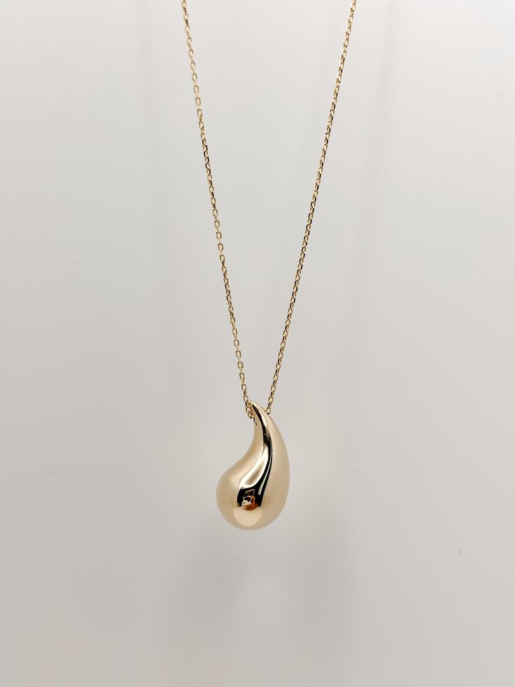 All of our pieces are crafted from 14k genuine solid gold, ensuring they do not tarnish and will last a lifetime. Our jewelry is designed for everyday wear, allowing you to sleep, shower, and exercise without worry. Your necklace will be elegantly packaged in a gift box and a soft suede jewelry pouch, which help maintain its cleanliness and prevent scratches. Your choice to support our small business means the world to us. We strive to be your go-to jeweler for meaningful gifts, whether it's for Classic Yellow Gold Teardrop Pendant Necklace, Classic Teardrop Yellow Gold Drop Necklace, Classic Yellow Gold Teardrop Drop Necklace, Gold Pear-shaped Necklace With Polished Finish, Classic Teardrop Tarnish Resistant Necklaces, Classic Teardrop Tarnish-resistant Necklaces, 14k Gold Drop Necklace For Anniversary, Yellow Gold Teardrop Necklace With Polished Finish, Tarnish Resistant Yellow Gold Teardrop Pendant Drop Necklace