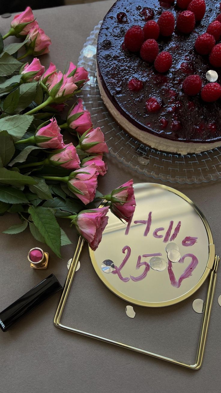 there is a cake and flowers on the table