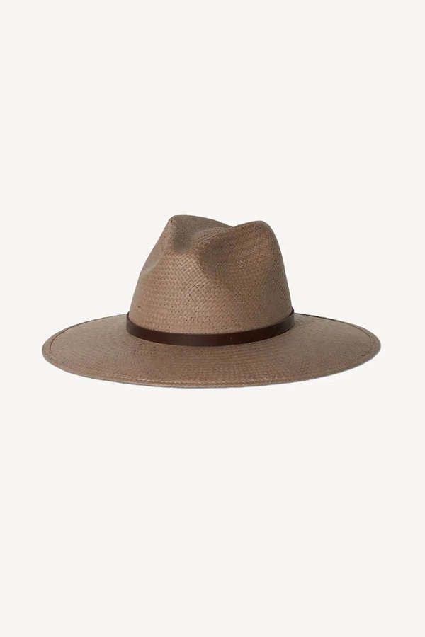 A best-selling packable straw hat. judith is finished with a rich brown regenerative leather strap and a statement knot detail on the back. this effortless piece can easily be worn year-round and is meant for traveling with you wherever you go.    details:    - 100% straw with regenerative leather band  - made in usa  - upf 35+  -   brim: 3.75" crown: 5"    photos from janessaleone.com    55 cm - small  57.5 cm - medium  59 cm - large  60 cm - extra large    about the brand:    janessa leoné was born and raised in southern california and launched her eponymous line of wool hats in 2013. the brand has since expanded into an internationally recognized lifestyle label with a flagship boutique in los angeles california.  with a focus on high-quality essentials and a commitment to sustainable p Women Fedora, Contemporary Clothes, Wool Hats, Janessa Leone, Caged Sandals, Lk Bennett, Black Aviators, Neon Purple, Indie Design