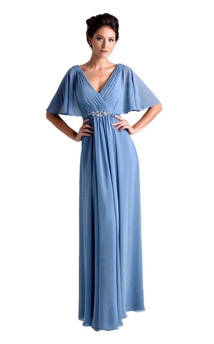 Nina Canacci M239 is a long draped chiffon long formal dress. Specialized for wedding guests & Mother of the Bride/Groom. This Mauve Ruched gown features draped chiffon sleeves for coverage & a flattering fitted waist with crystal embellishments. Available Size: 10 Available Color: Mauve Formal Chiffon V-neck Gown, Chiffon V-neck Gown For Banquet, Elegant Flowy Chiffon Bridesmaid Dress, Elegant Flowy Mother Of The Bride Dress For Party, Elegant Chiffon Evening Dress For Wedding, Chiffon Banquet Dress With Pleated Bodice, Chiffon Dresses With Pleated Bodice For Banquet, Chiffon Evening Dress With Pleated Bodice For Wedding, Banquet Chiffon Dress With Pleated Bodice