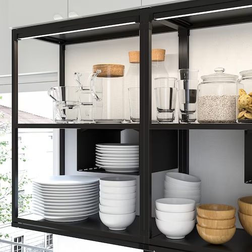 the shelves are filled with dishes and bowls